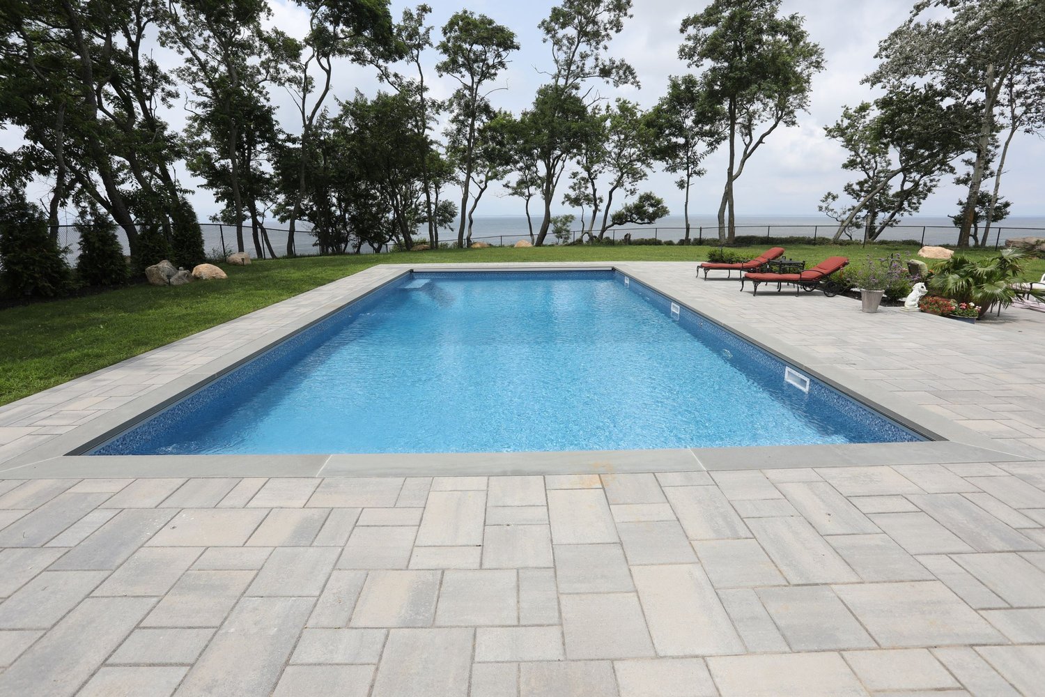 Waterfront geometric pool overlooking the water