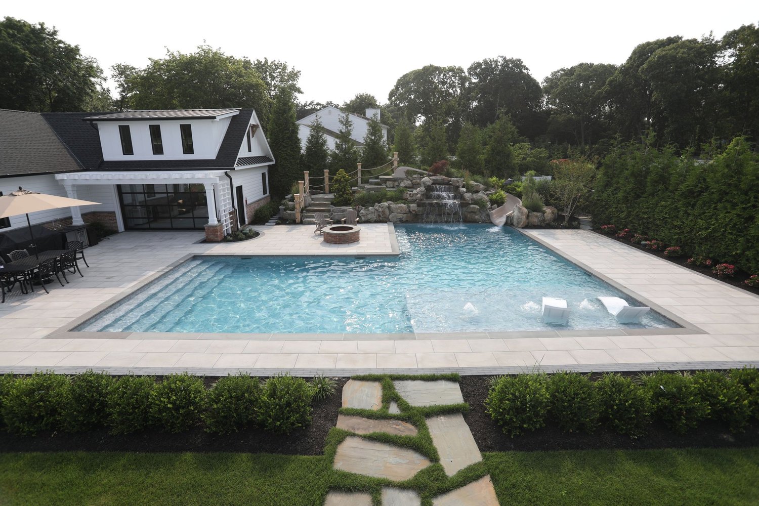 Pool house with in-pool loungers